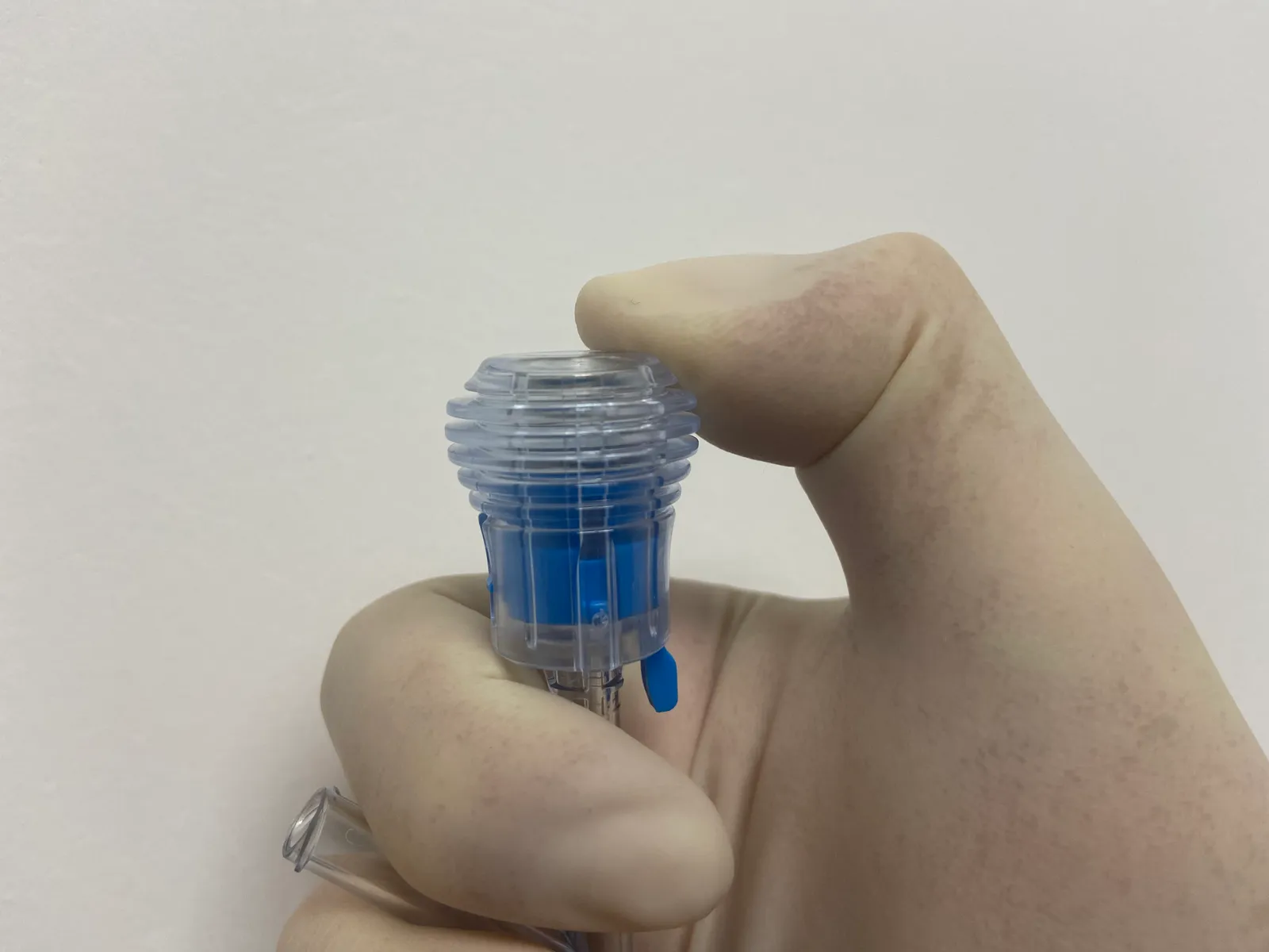 Push-Click Y connector held in a gloved hand